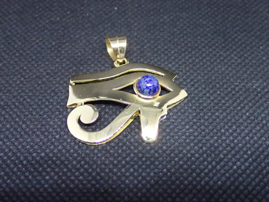 Pendentif oeil de ra en or jaune 750/ème de 7.80g, lapis lazuli/ Bijoux d'occasion