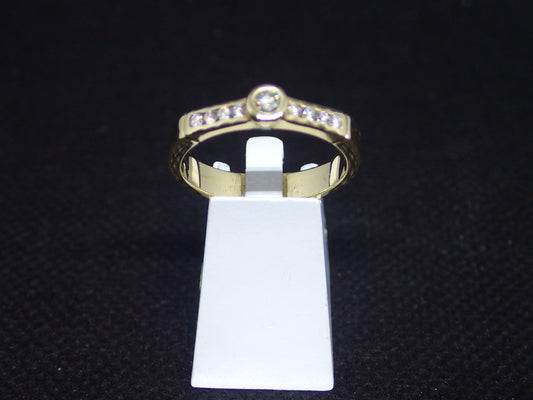 Solitaire accompagné en or jaune 750/ème de 3.90g, diamant / Bijoux d'occasion