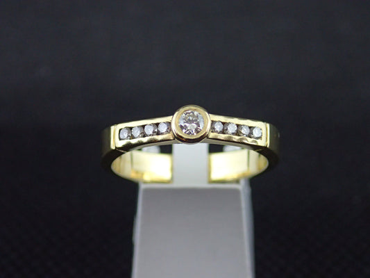 Solitaire accompagné en or jaune 750/ème de 3.90g, diamant / Bijoux d'occasion