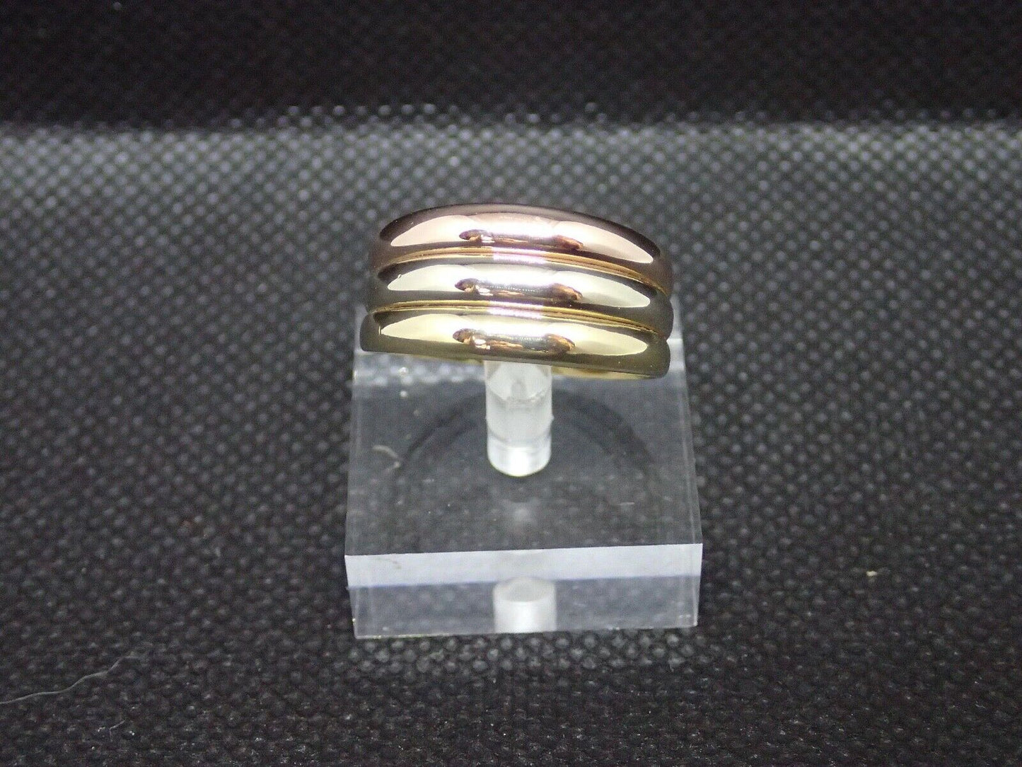 Bague tricolore or 750/ème de 4.54g. Largeur de 10.4mm, T60 / Bijoux d'occasion